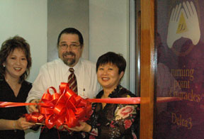 Cal cuts the ribbon at Grand Opening Ceremony